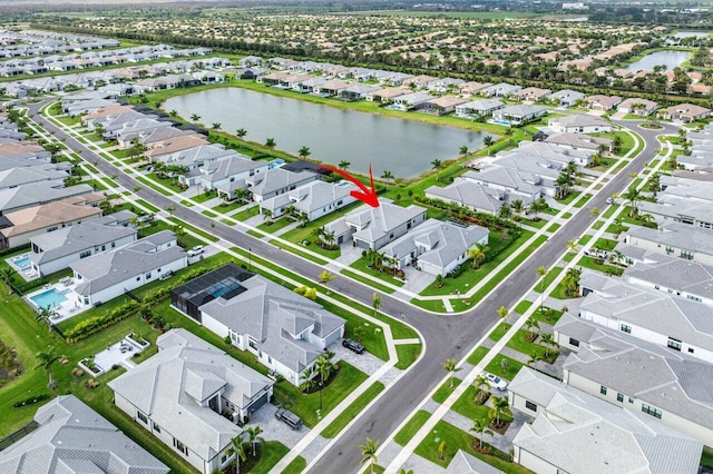 bird's eye view with a water view and a residential view