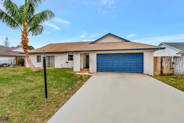 ranch-style home featuring stucco siding, a front yard, fence, a garage, and driveway