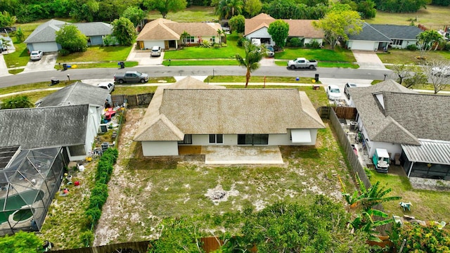 birds eye view of property with a residential view