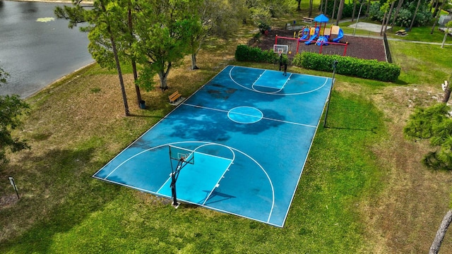 view of basketball court with community basketball court, a lawn, and playground community