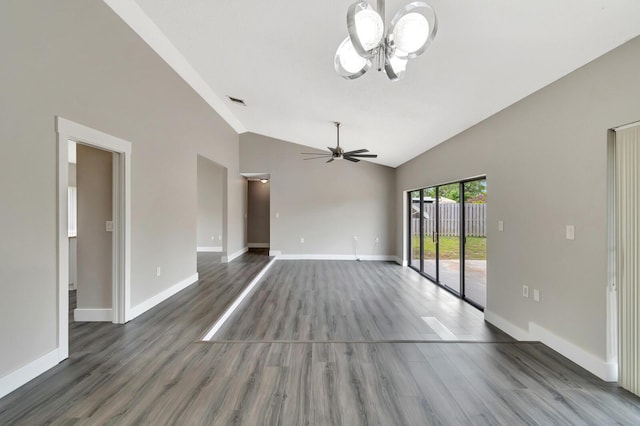 unfurnished living room with high vaulted ceiling, baseboards, and wood finished floors