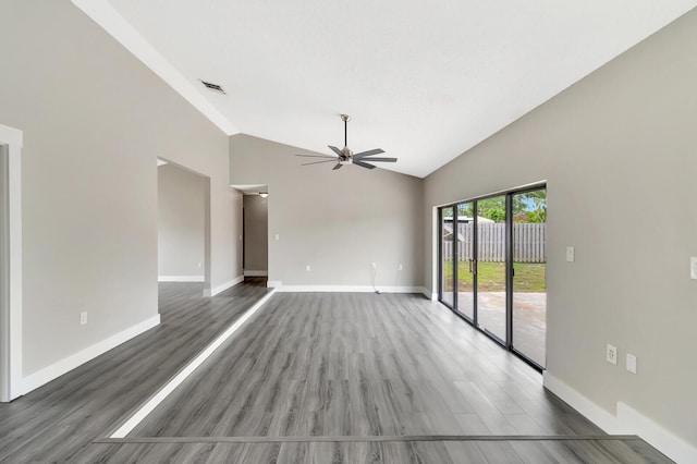 unfurnished room featuring ceiling fan, wood finished floors, visible vents, and baseboards