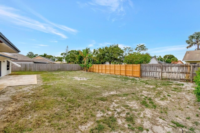 view of yard featuring a fenced backyard and a patio