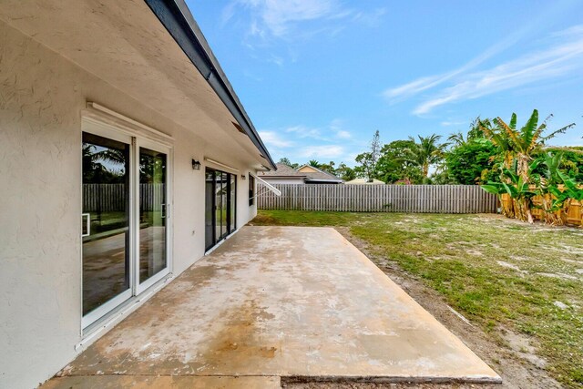 view of yard featuring a fenced backyard and a patio