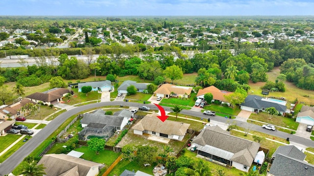 birds eye view of property with a residential view