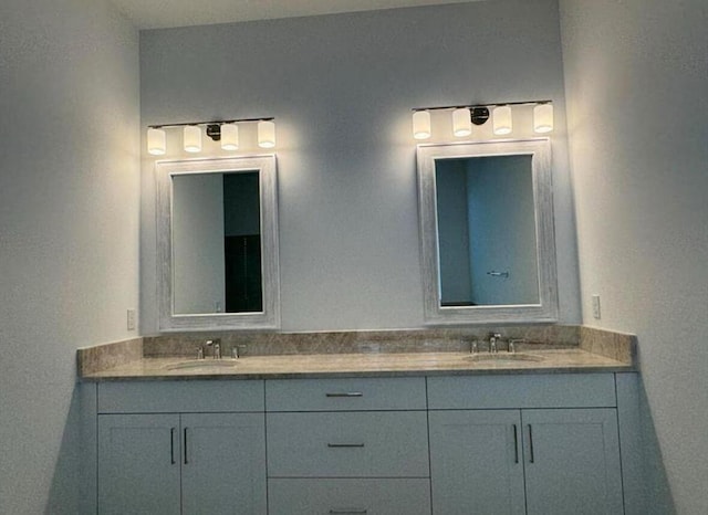 bathroom featuring double vanity and a sink