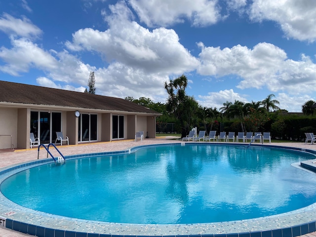 pool with a patio area