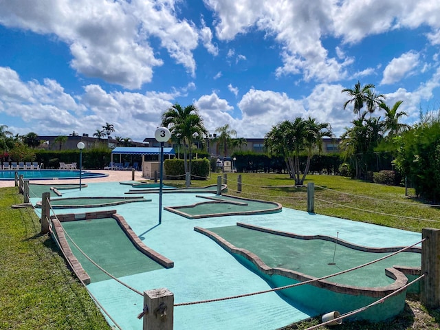 view of property's community featuring a yard