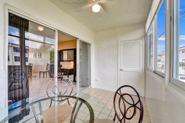 sunroom / solarium with ceiling fan