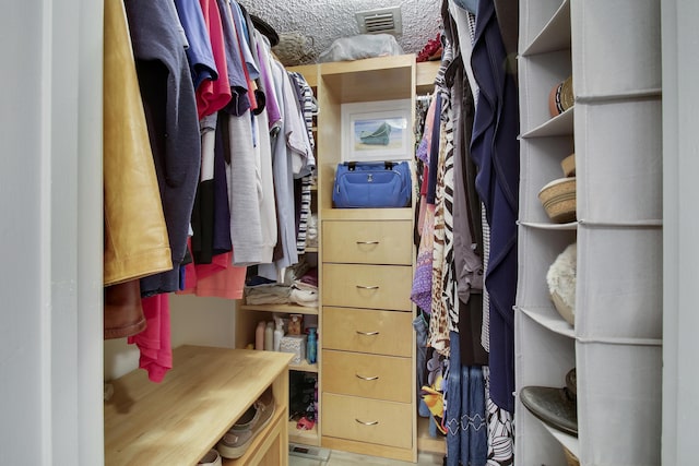 walk in closet with visible vents