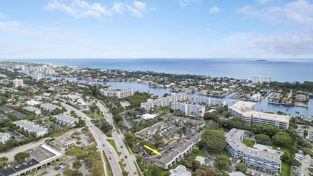 drone / aerial view featuring a water view and a city view