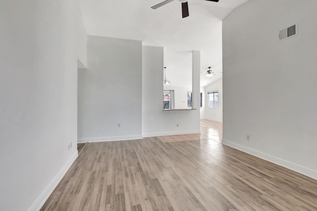 5598 Pebble Brook Ln, Boynton Beach, FL 33472 - unfurnished living room featuring ceiling fan, baseboards, visible vents, and light wood-style floors