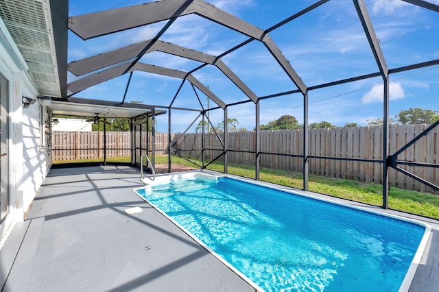 5598 Pebble Brook Ln, Boynton Beach, FL 33472 - view of swimming pool with glass enclosure, a patio area, a fenced backyard, and a fenced in pool