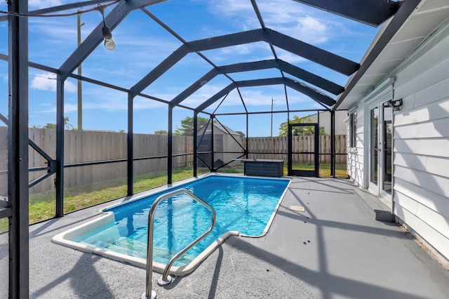 5598 Pebble Brook Ln, Boynton Beach, FL 33472 - view of pool featuring glass enclosure, a patio area, and a fenced backyard