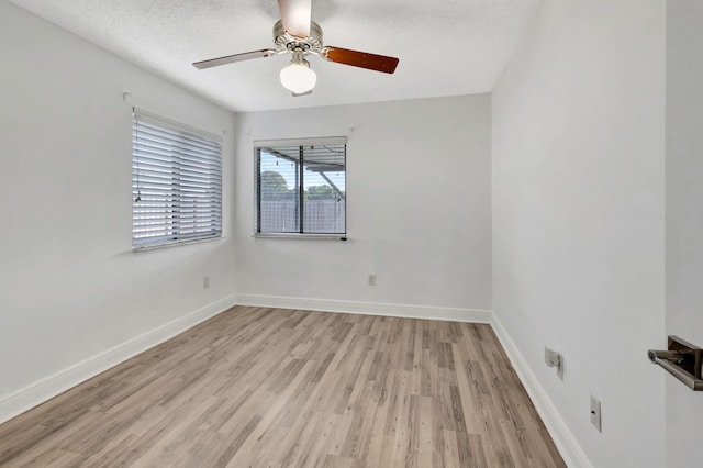 5598 Pebble Brook Ln, Boynton Beach, FL 33472 - unfurnished room with baseboards, ceiling fan, a textured ceiling, and light wood-style floors