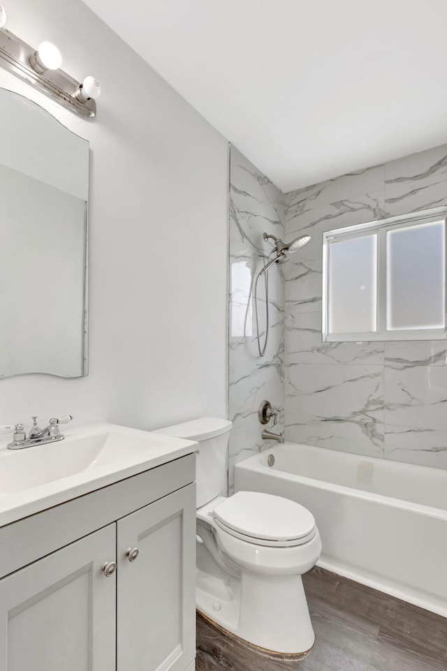 5598 Pebble Brook Ln, Boynton Beach, FL 33472 - full bathroom featuring toilet, shower / bath combination, wood finished floors, and vanity
