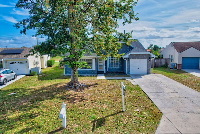 5598 Pebble Brook Ln, Boynton Beach, FL 33472 - view of front of house with a garage, brick siding, fence, concrete driveway, and a front lawn