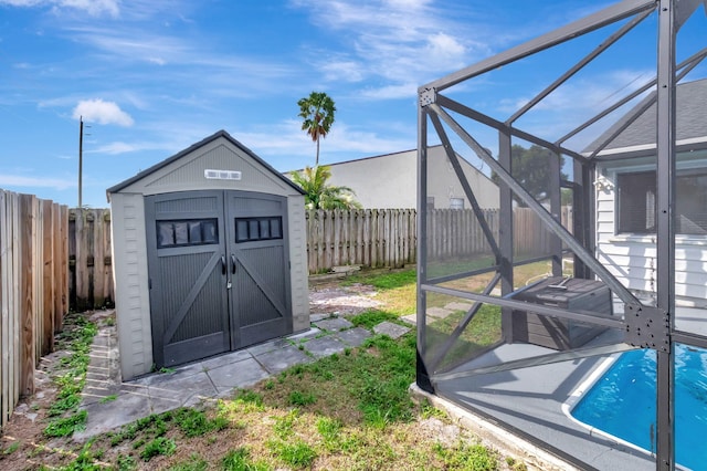 5598 Pebble Brook Ln, Boynton Beach, FL 33472 - view of shed featuring a fenced backyard and a fenced in pool