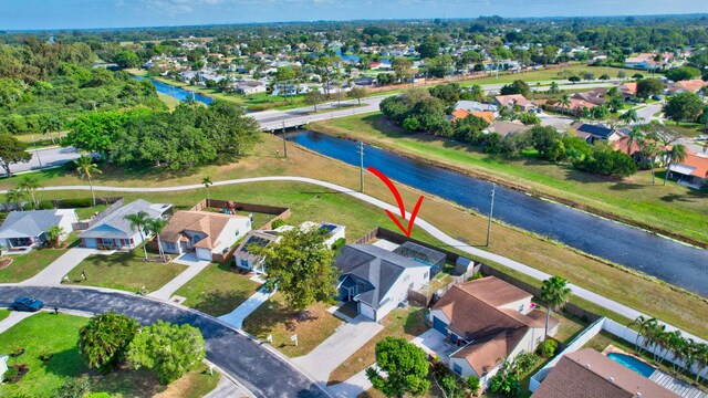 5598 Pebble Brook Ln, Boynton Beach, FL 33472 - drone / aerial view featuring a water view and a residential view