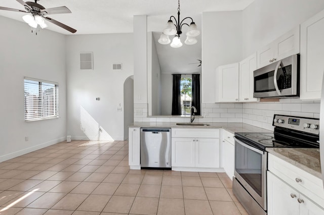 5598 Pebble Brook Ln, Boynton Beach, FL 33472 - kitchen with appliances with stainless steel finishes, white cabinetry, a sink, and visible vents
