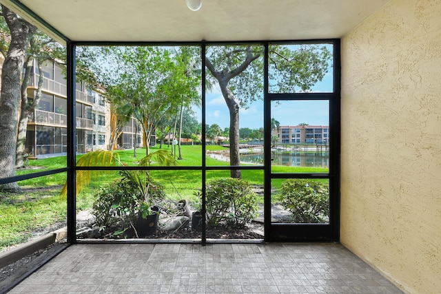 6705 Coral Lake Dr Unit 6705, Margate, FL 33063 - unfurnished sunroom with a water view