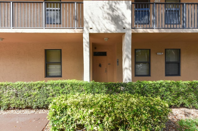 6705 Coral Lake Dr Unit 6705, Margate, FL 33063 - property entrance with stucco siding and a balcony