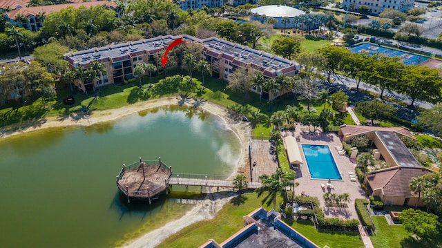 6705 Coral Lake Dr Unit 6705, Margate, FL 33063 - drone / aerial view of a pool area and a nearby body of water