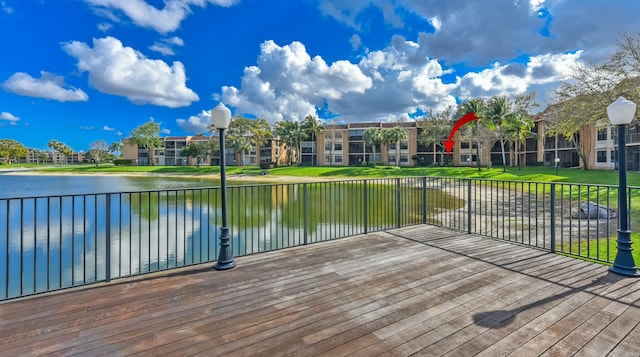 6705 Coral Lake Dr Unit 6705, Margate, FL 33063 - wooden deck featuring a water view and a lawn