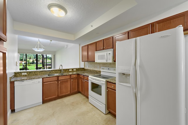 6705 Coral Lake Dr Unit 6705, Margate, FL 33063 - kitchen with white appliances, a sink, a textured ceiling, backsplash, and brown cabinetry