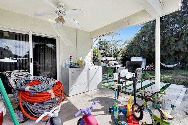 view of patio / terrace featuring ceiling fan, exterior kitchen, a grill, and washer and dryer