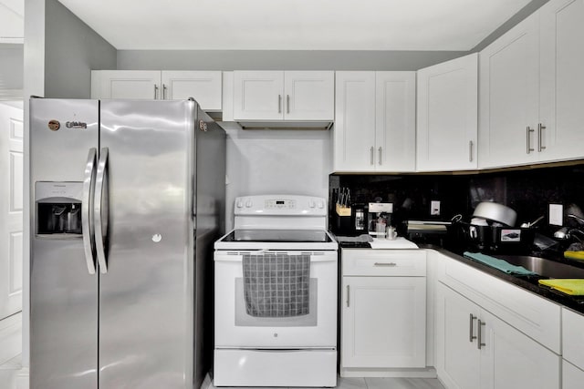 kitchen with dark countertops, electric stove, white cabinetry, and stainless steel refrigerator with ice dispenser