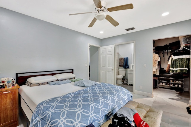 bedroom featuring recessed lighting, a closet, visible vents, a spacious closet, and ensuite bathroom