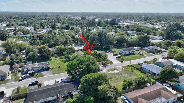 birds eye view of property with a residential view