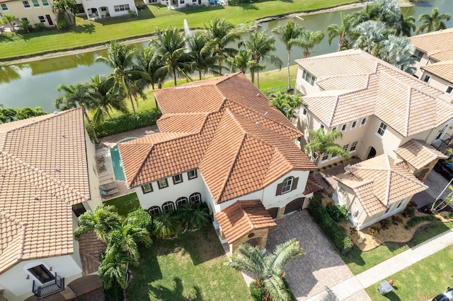 bird's eye view featuring a water view and a residential view