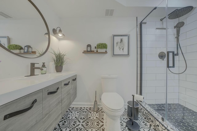 full bathroom featuring tile patterned flooring, visible vents, vanity, and toilet