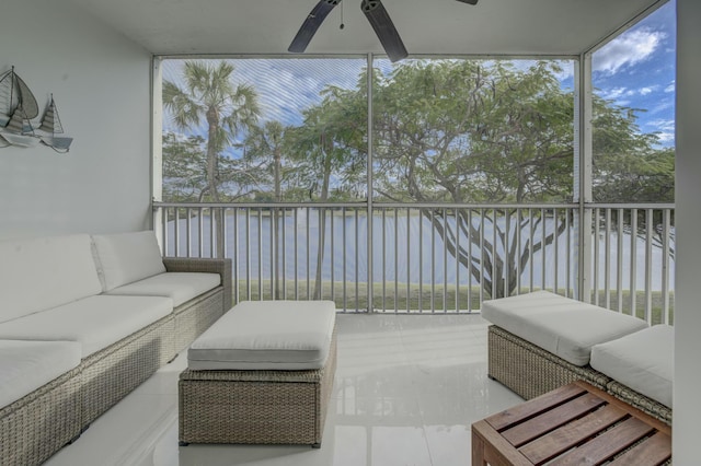 sunroom / solarium with a ceiling fan