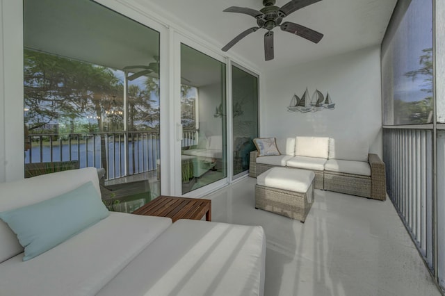 balcony with a water view, ceiling fan, and an outdoor hangout area