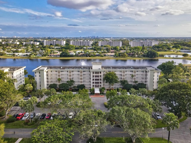 drone / aerial view featuring a water view and a view of city