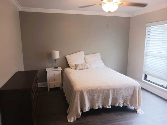 bedroom featuring a ceiling fan, ornamental molding, and dark wood-type flooring