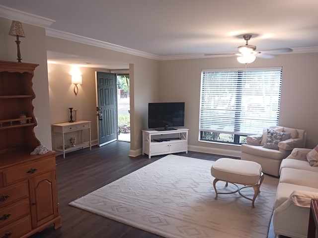 living area with ceiling fan, ornamental molding, dark wood-type flooring, and baseboards