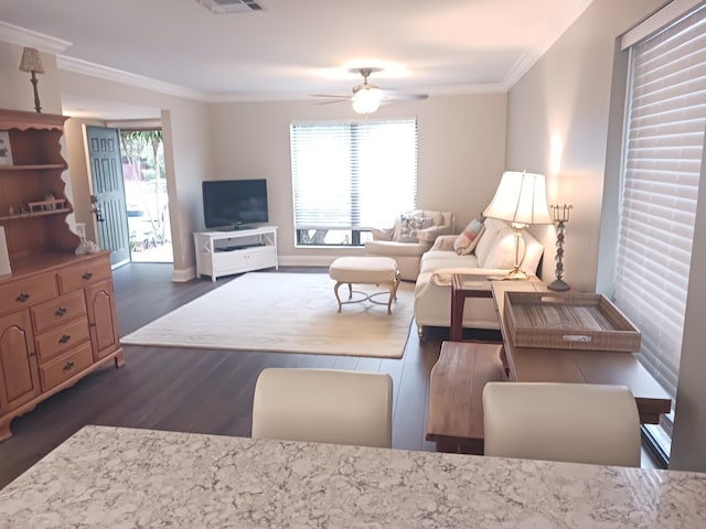 living area with ceiling fan, dark wood-style flooring, visible vents, and crown molding