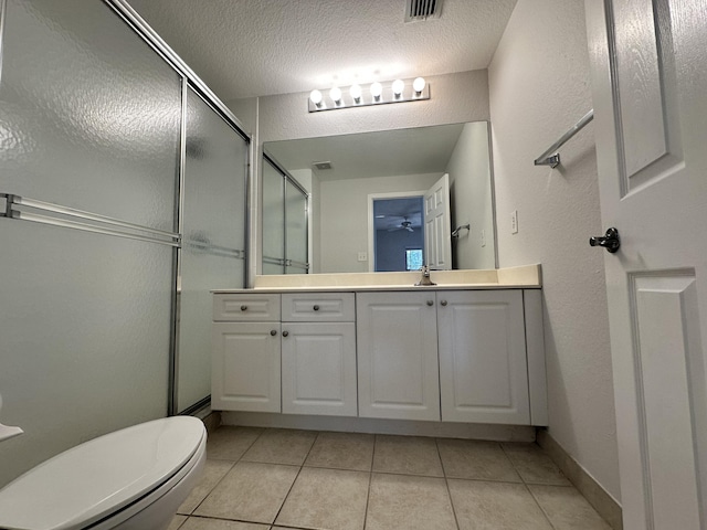 bathroom featuring a stall shower, tile patterned flooring, vanity, and visible vents