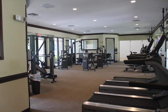 exercise room with recessed lighting, visible vents, and crown molding