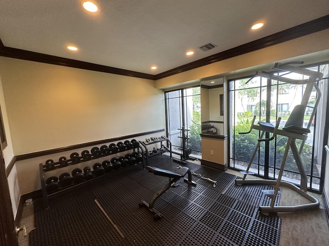 workout area featuring ornamental molding, recessed lighting, visible vents, and baseboards