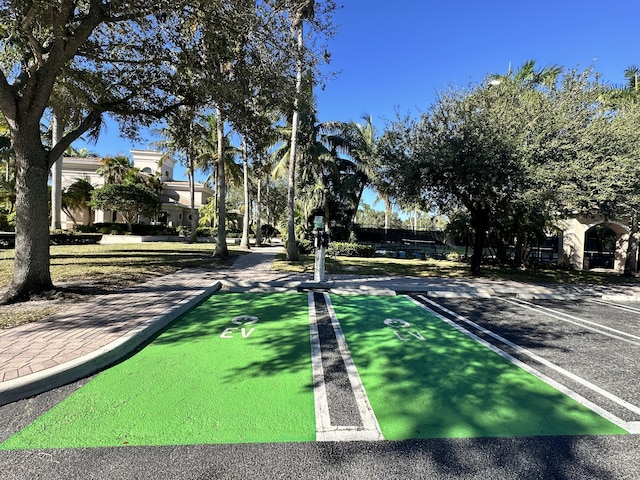 view of home's community featuring shuffleboard