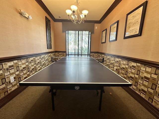 game room with carpet floors, a chandelier, crown molding, and wainscoting