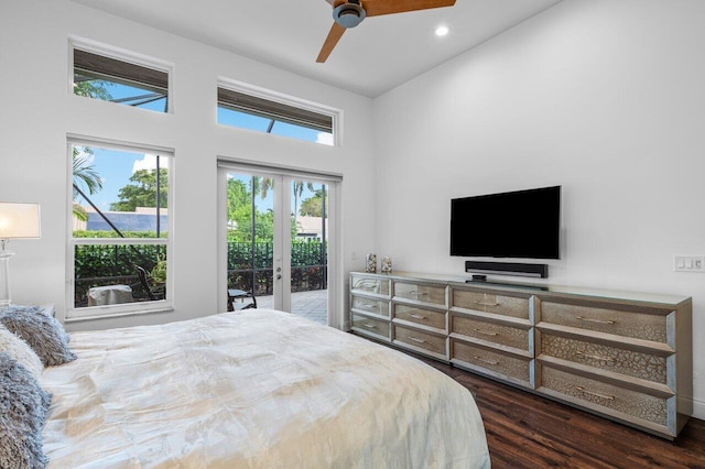 bedroom with access to exterior, multiple windows, dark wood finished floors, and french doors