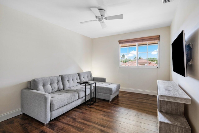 living room with ceiling fan, hardwood / wood-style floors, and baseboards