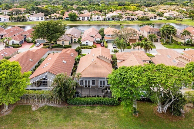 aerial view with a residential view and a water view