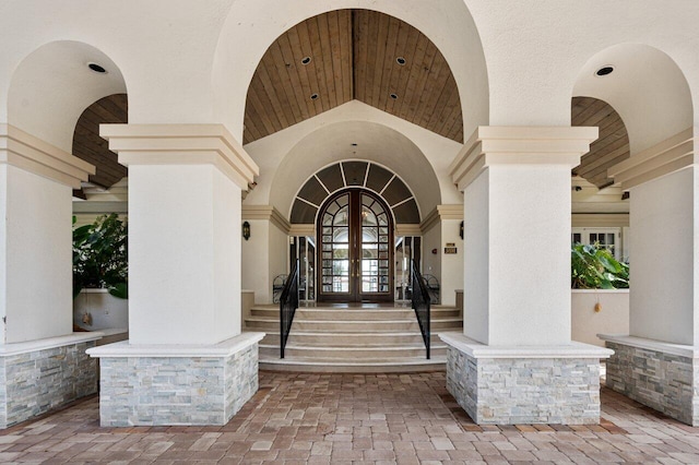 property entrance with french doors and stucco siding